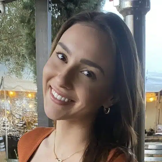 A young woman smiling for the camera.